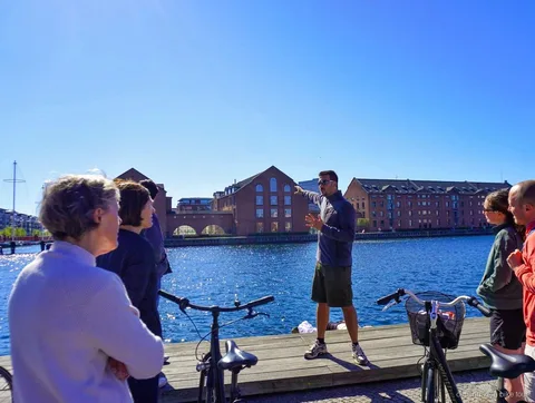 Riders at CopenHill's rooftop ski slope on a Copenhagen architecture bike tour