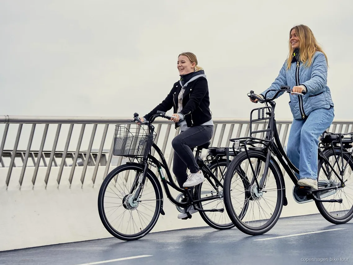 Rider on a Danish-designed e-bike near the Copenhagen Opera House