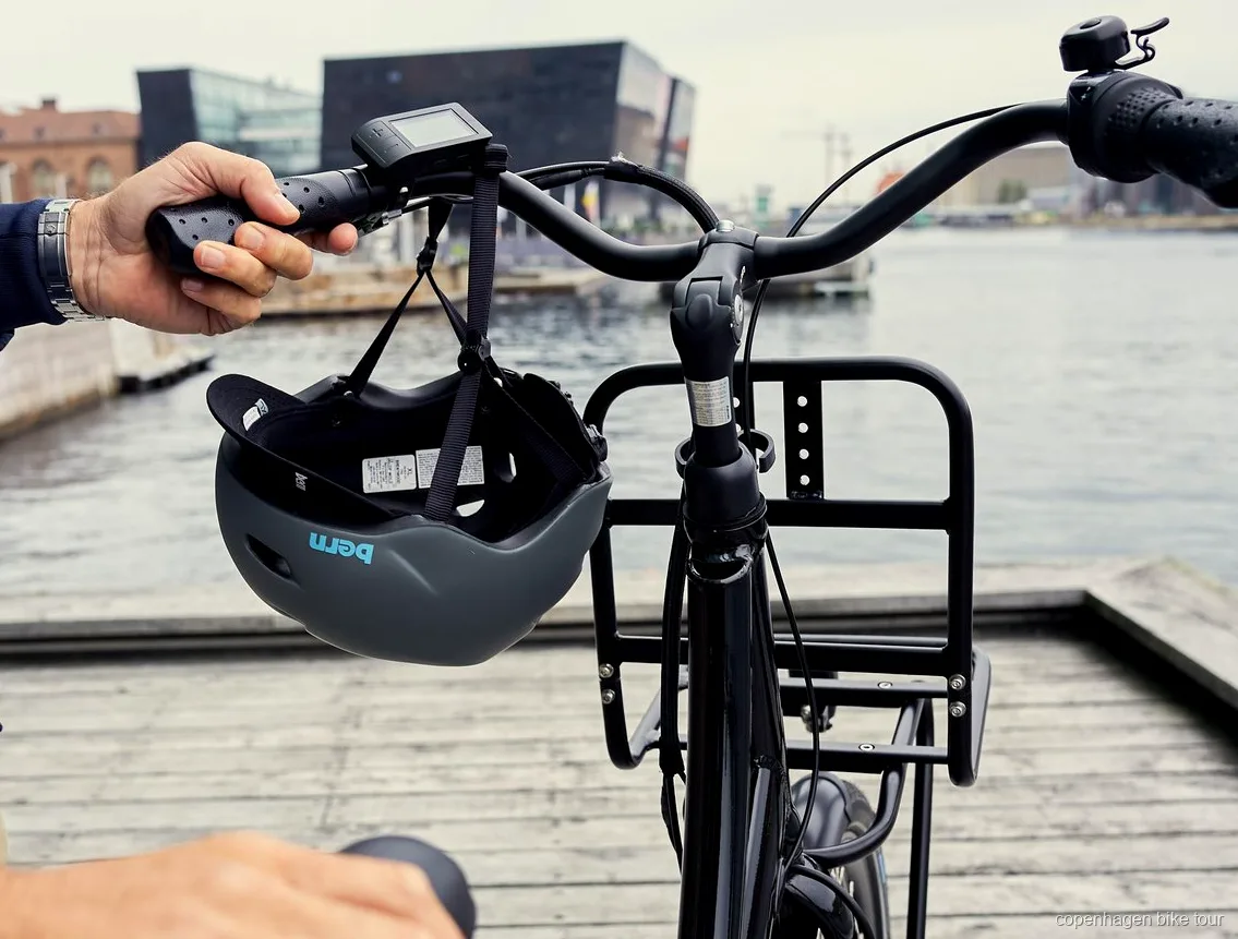Guide wearing a radio headset leading a Copenhagen e-bike tour group