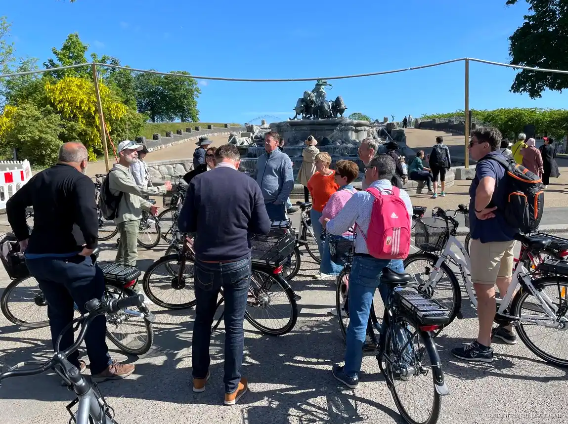 Riders passing Amalienborg Palace on a Copenhagen e-bike tour