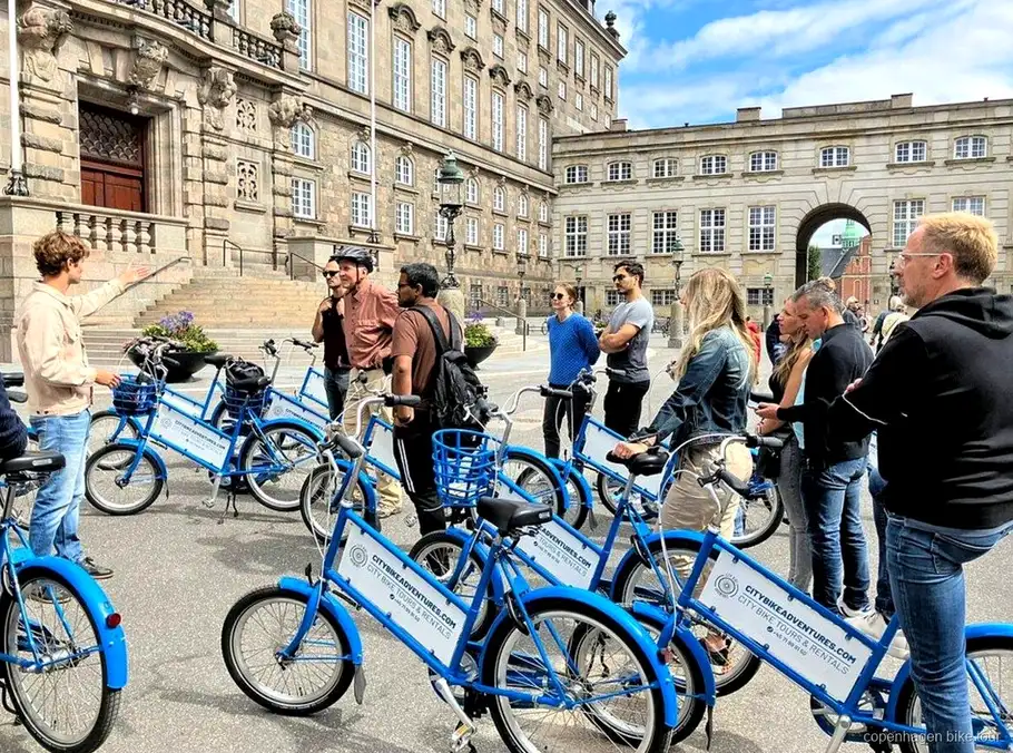 Guide pointing out the Black Diamond library during a Copenhagen bike tour